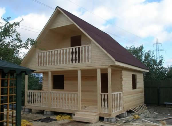 мягкая кровля на доме из бруса с мансардой